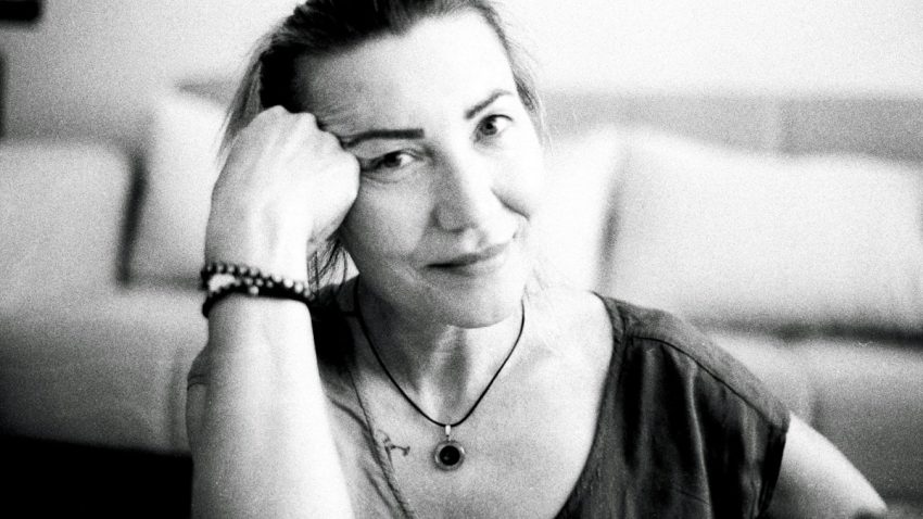 a black and white photo of a woman in a living room